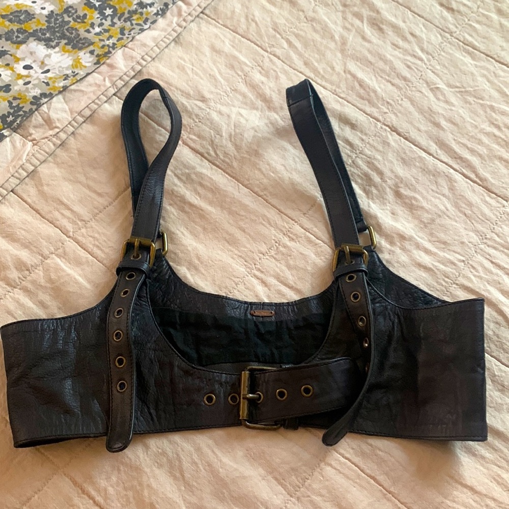 Leather black accessory to wear over shirt